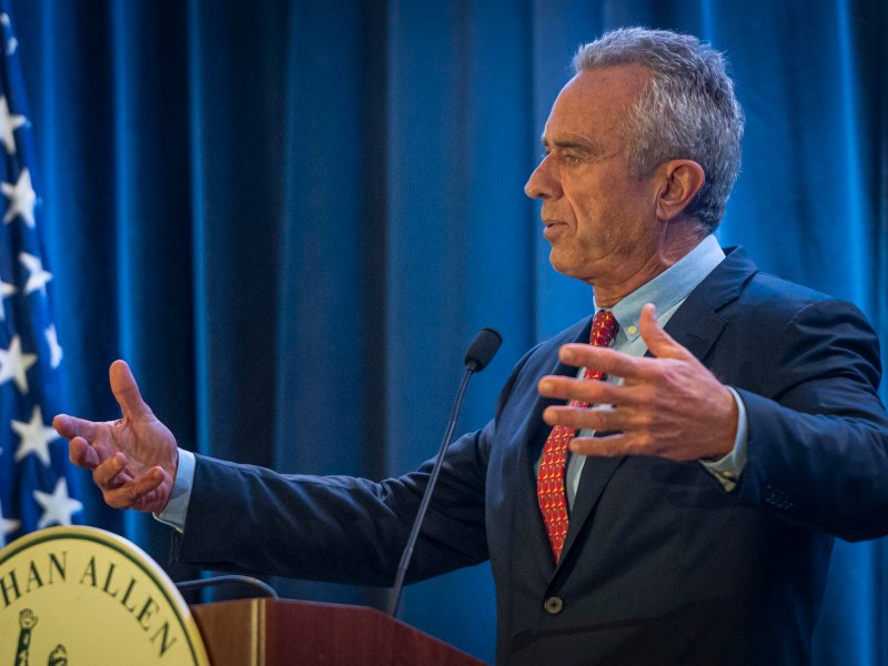 a man standing at a podium giving a speech.