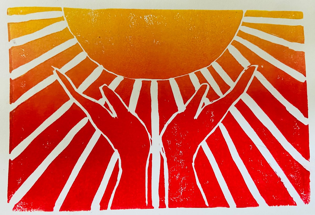 Two hands are raised upward, appearing to hold a large sun with rays shining outward in shades of yellow, orange, and red.